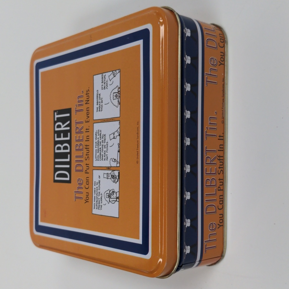 The Dilbert tin, "You can put stuff in it" orange square cookie box